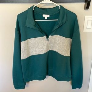 Women’s grey and teal pullover.